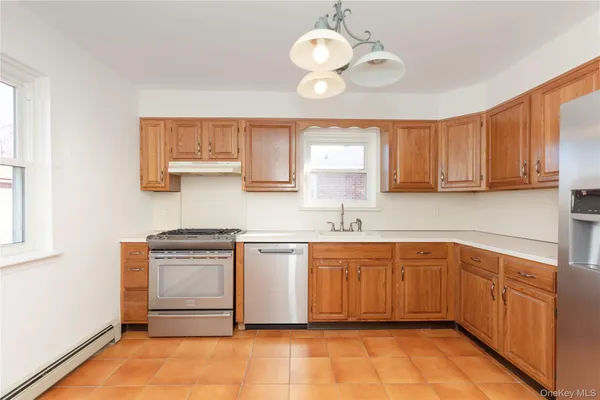 a kitchen with stainless steel appliances granite countertop a sink and cabinets