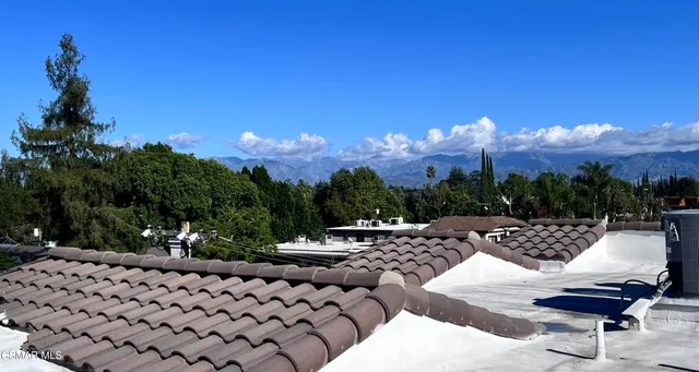 a view of a chairs and tables in the patio