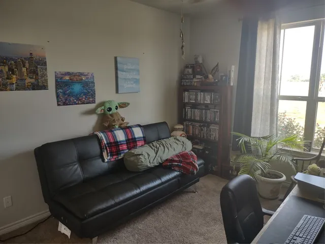 a room with furniture and a wooden floor