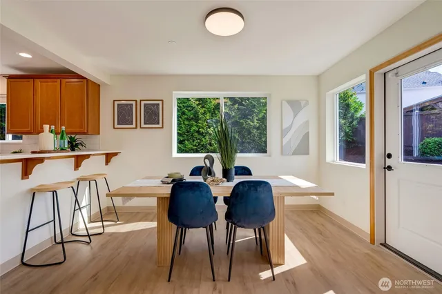 a view of a dining room with furniture window and outside view
