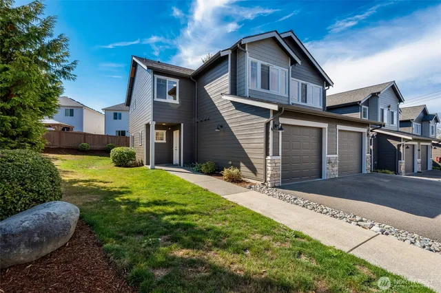 a front view of a house with garden