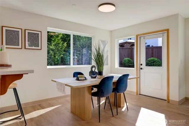 a view of a dining room with furniture window and outside view