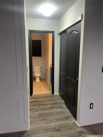 a view of a bathroom from a hallway