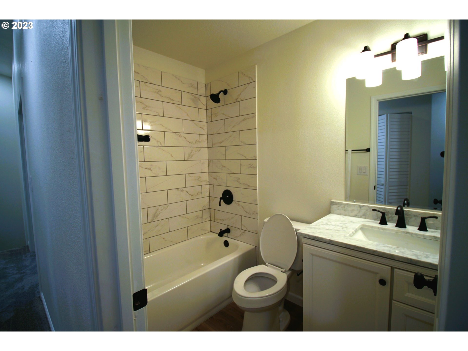 3864 Aerial Way Eugene, OR 97402 - Photo 14 of 22 a bathroom with a sink a toilet and shower