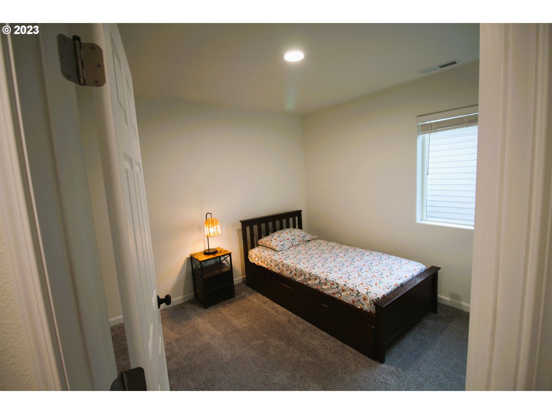 3864 Aerial Way Eugene, OR 97402 - Photo 19 of 22 a bedroom with a bed and window