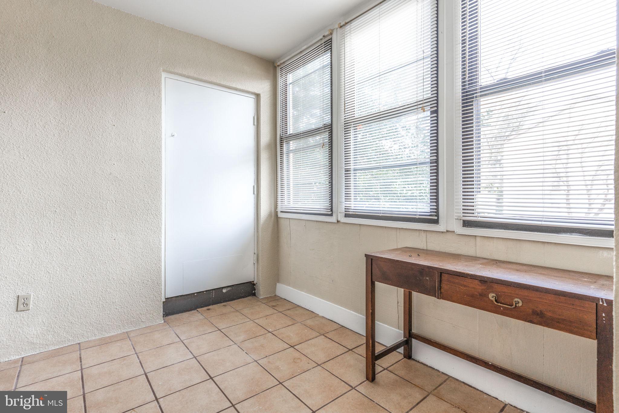 9653 White Acre Road, Unit B2 Columbia, MD 21045 - Photo 17 of 28 a view of an empty room with a window