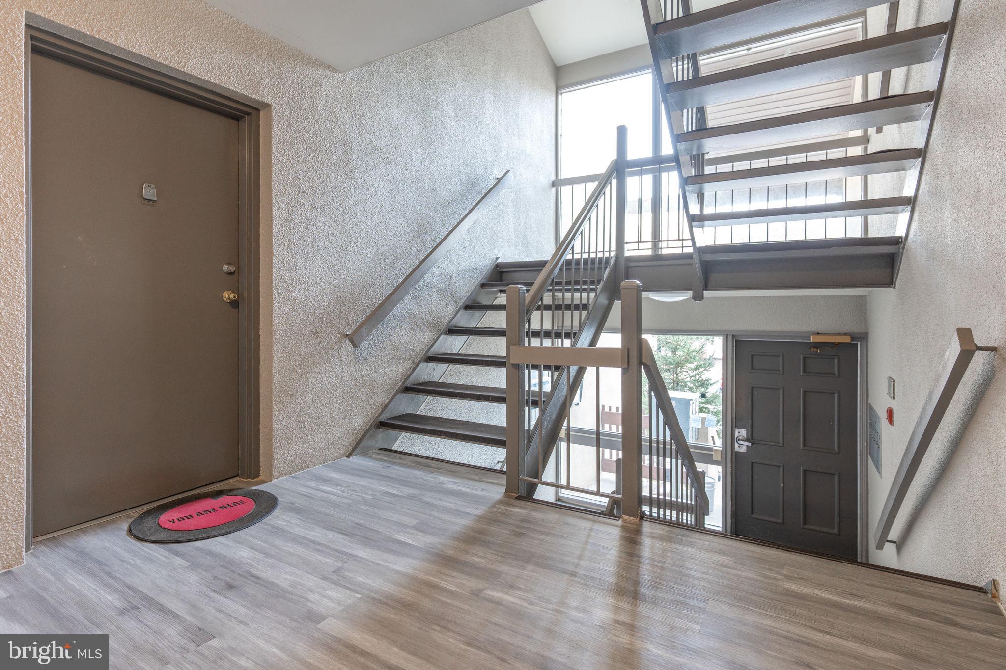 9653 White Acre Road, Unit B2 Columbia, MD 21045 - Photo 5 of 28 a view of entryway and hall with wooden floor