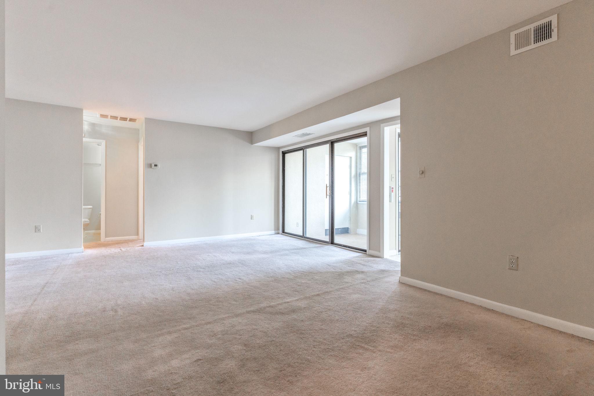 9653 White Acre Road, Unit B2 Columbia, MD 21045 - Photo 8 of 28 a view of empty room with windows