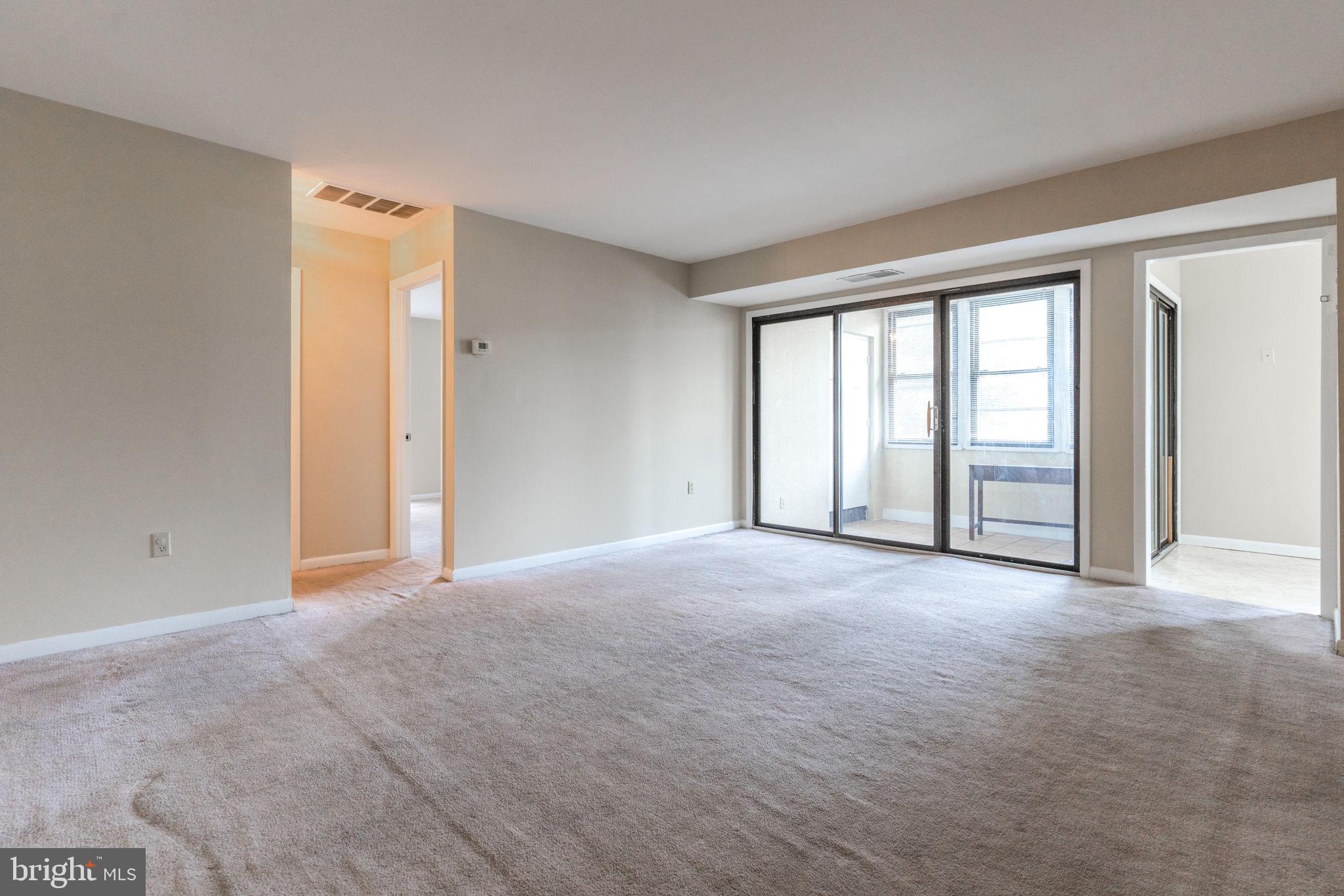 9653 White Acre Road, Unit B2 Columbia, MD 21045 - Photo 9 of 28 a view of an empty room with a window