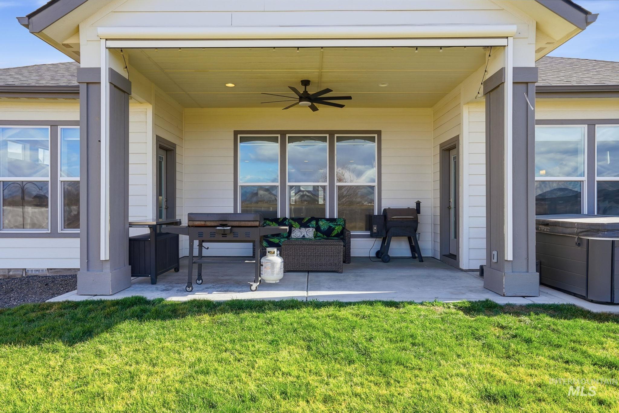 2301 Nordic Avenue Middleton, ID 83644 - Photo 36 of 50 View of patio with a hot tub, a ceiling fan, grilling area, and outdoor furniture