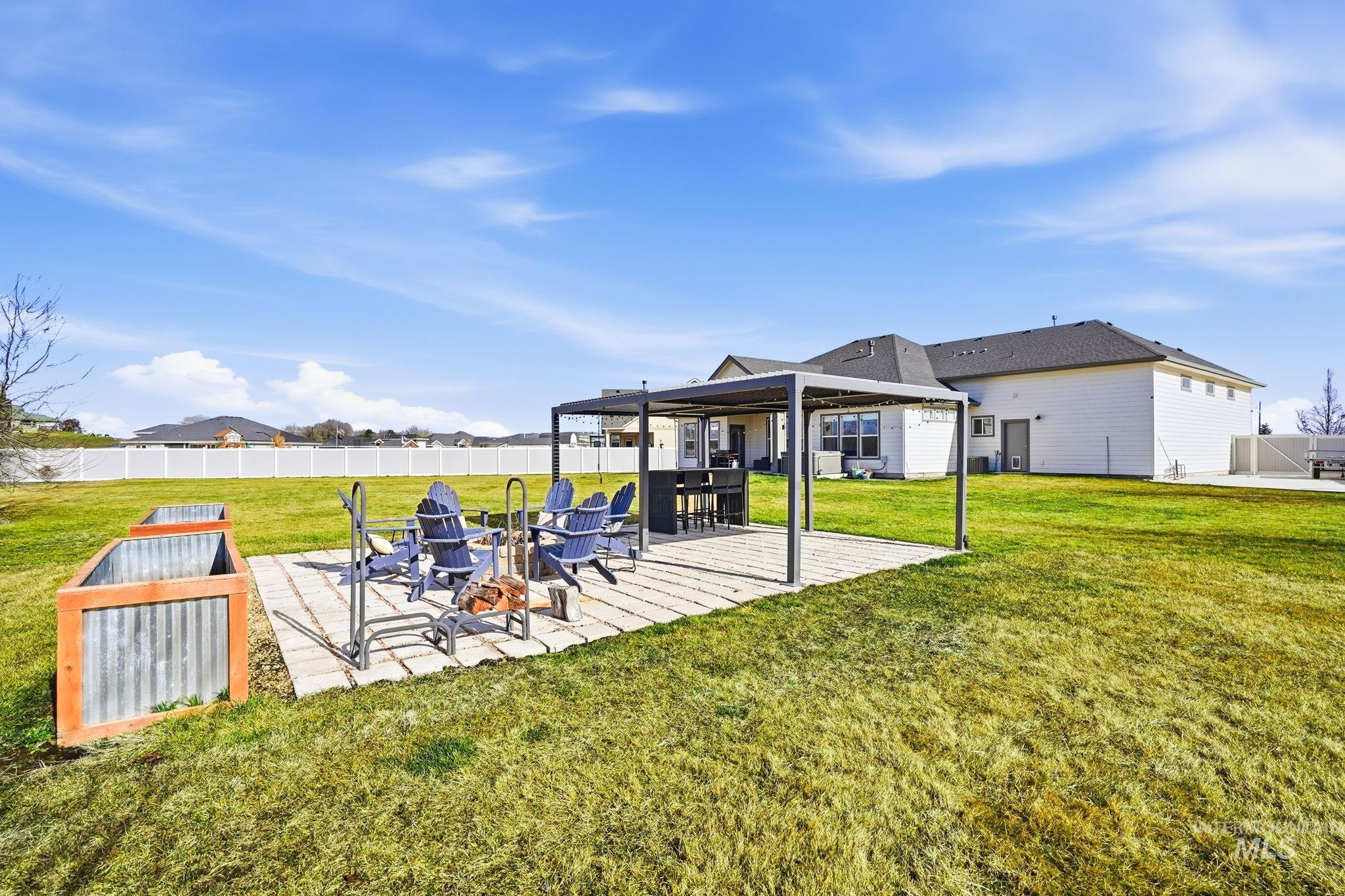 2301 Nordic Avenue Middleton, ID 83644 - Photo 38 of 50 Fenced yard with a patio and an outdoor fire pit
