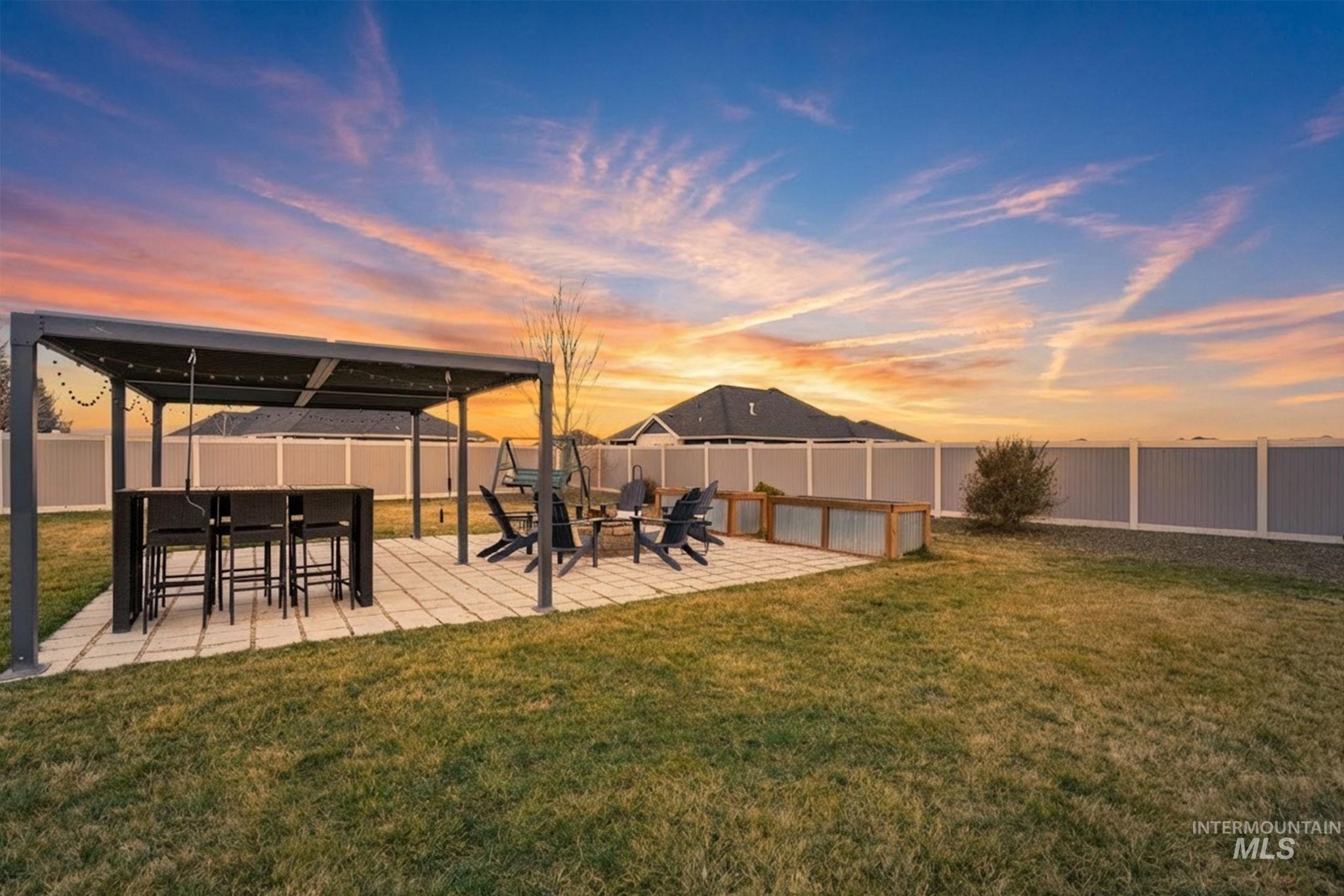 2301 Nordic Avenue Middleton, ID 83644 - Photo 39 of 50 Yard at dusk with a fenced backyard and a patio