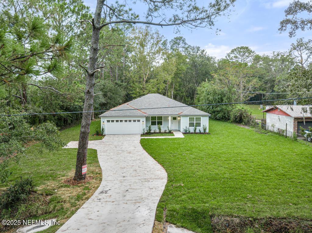 5124 Parete Road South Jacksonville, FL 32218 - Photo 2 of 42 a view of a house with garden