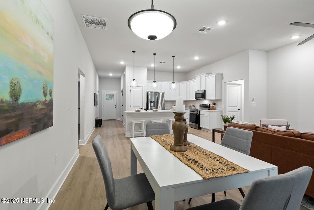 5124 Parete Road South Jacksonville, FL 32218 - Photo 24 of 42 a view of a dining room with furniture