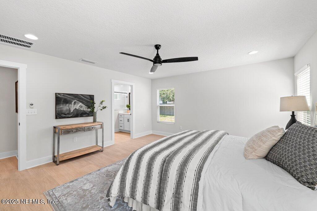 5124 Parete Road South Jacksonville, FL 32218 - Photo 29 of 42 a bedroom with a bed and a flat screen tv