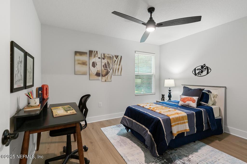 5124 Parete Road South Jacksonville, FL 32218 - Photo 35 of 42 a bedroom with a bed and a table