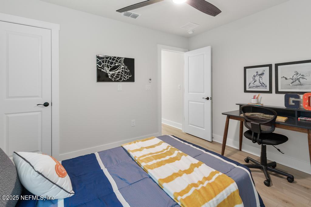 5124 Parete Road South Jacksonville, FL 32218 - Photo 36 of 42 a view of a workspace with furniture and wooden floor