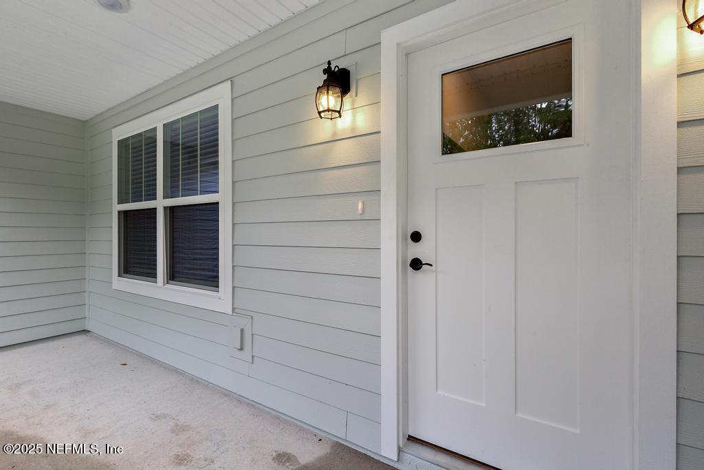5124 Parete Road South Jacksonville, FL 32218 - Photo 6 of 42 a view of a hallway that has front door