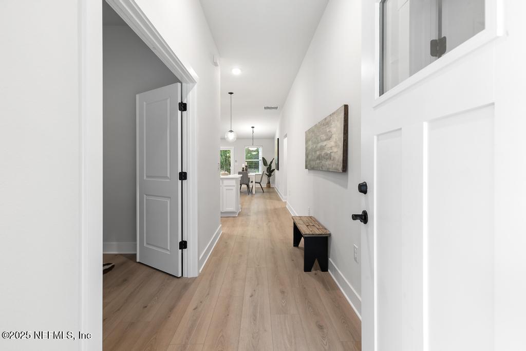 5124 Parete Road South Jacksonville, FL 32218 - Photo 7 of 42 a view of a hallway view with wooden floor and living room