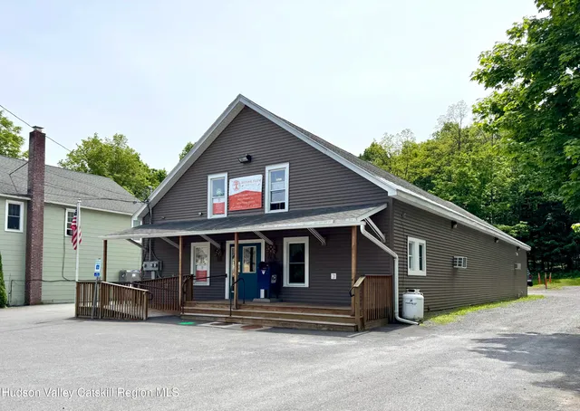 a view of a house with a patio and balcony
