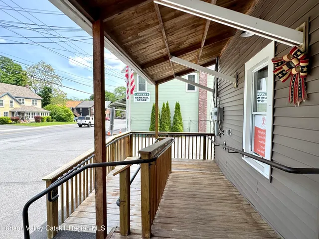 a view of a porch with wooden floor