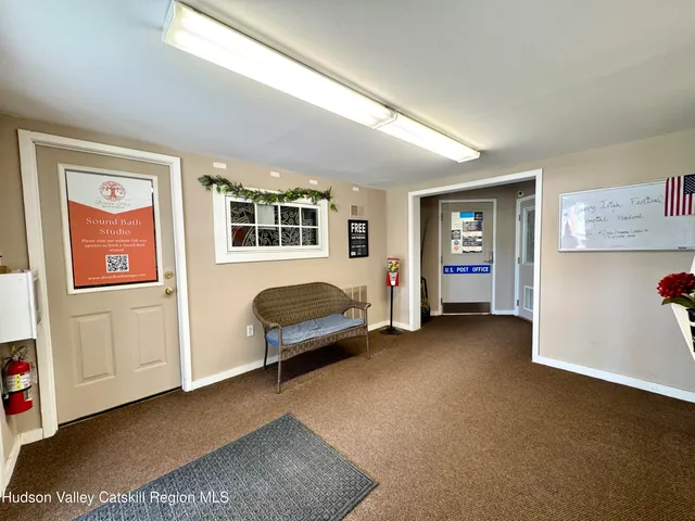 a view of a livingroom with furniture and windows