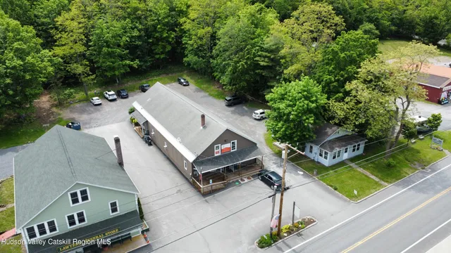 an aerial view of house with yard
