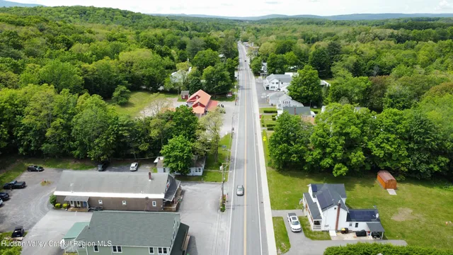 an aerial view of house with yard swimming pool and outdoor seating