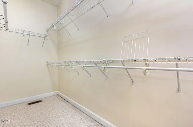 a bathroom with a sink toilet vanity and shower