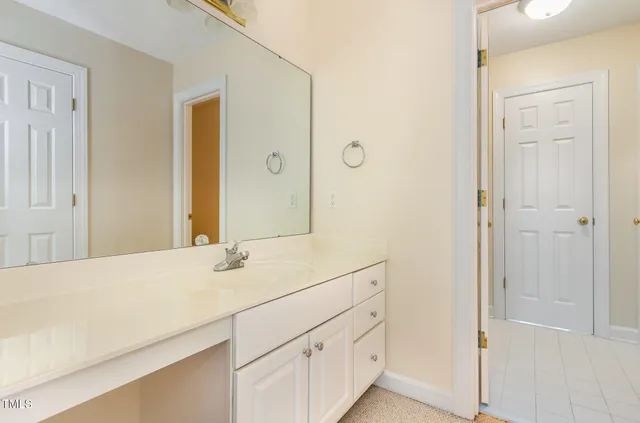 a bedroom with a bed and large window