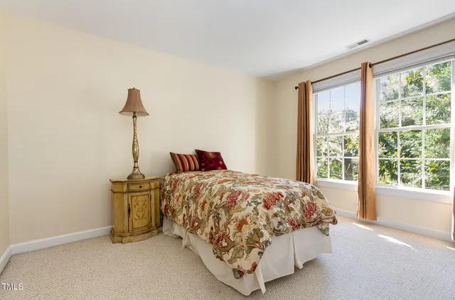 a wooden deck with trees in front of it