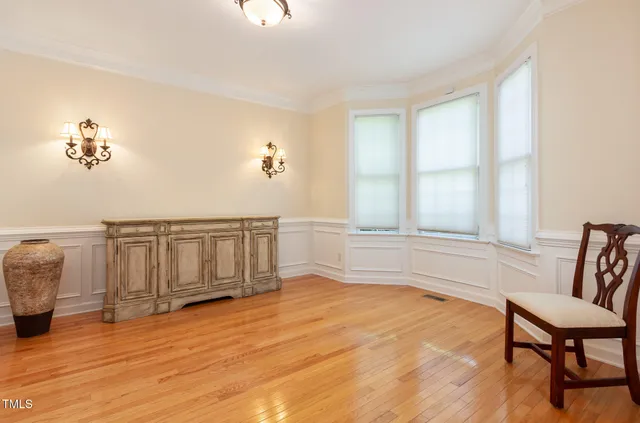 a view of a livingroom with furniture and staircase