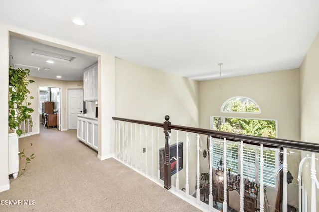 a view of a hallway with windows