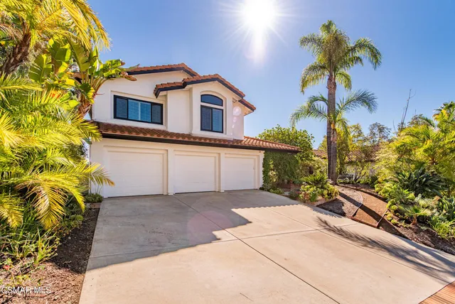 a house view with a garden space