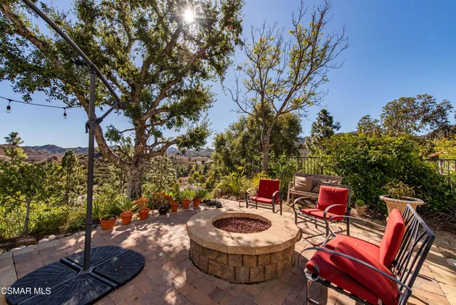 a backyard of a house with outdoor seating