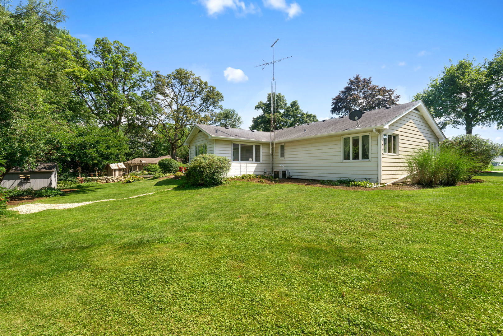 43W836 Hughes Road Elburn, IL 60119 - Photo 14 of 17 a front view of house with yard and green space