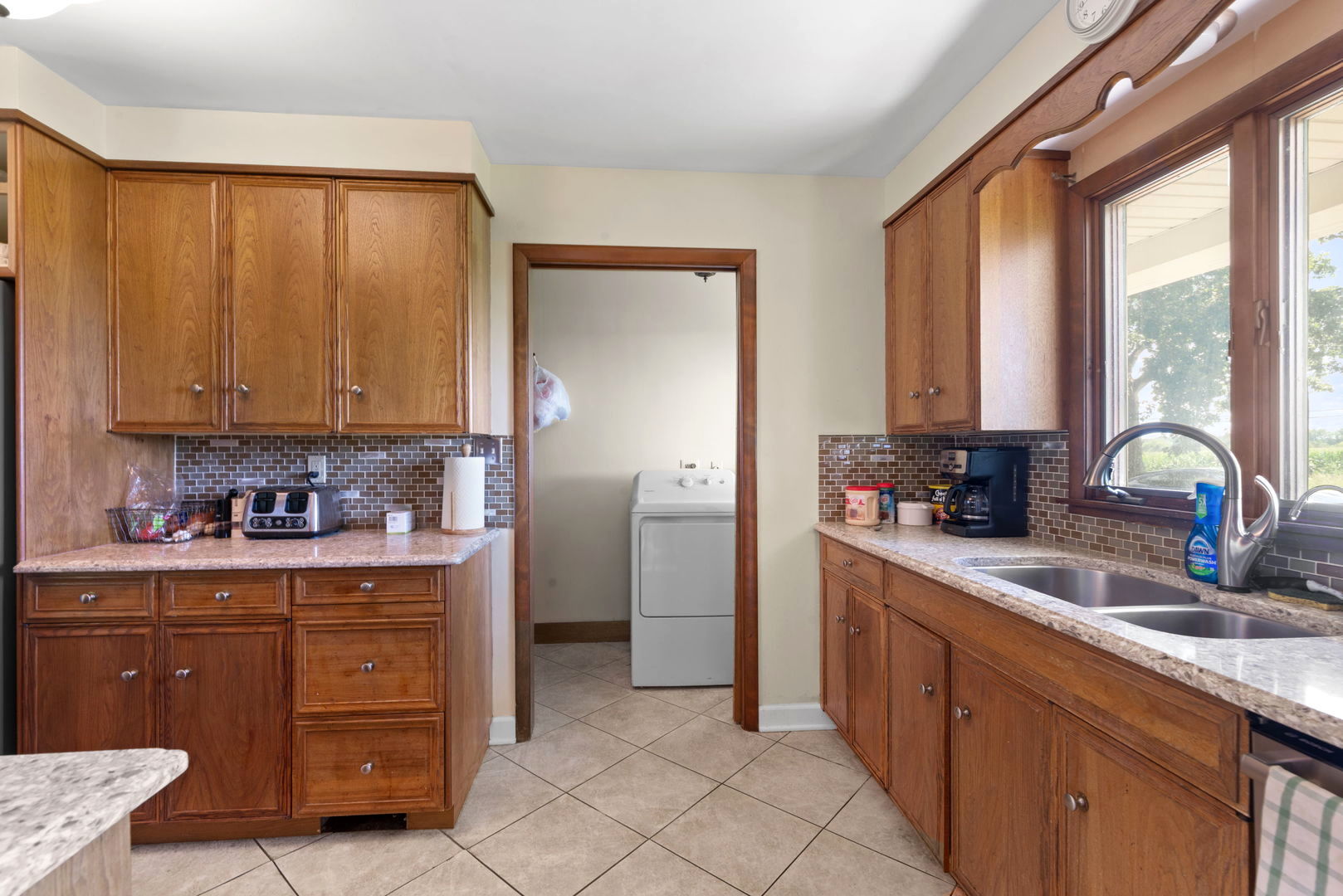 43W836 Hughes Road Elburn, IL 60119 - Photo 6 of 17 a kitchen with a refrigerator a sink and cabinets
