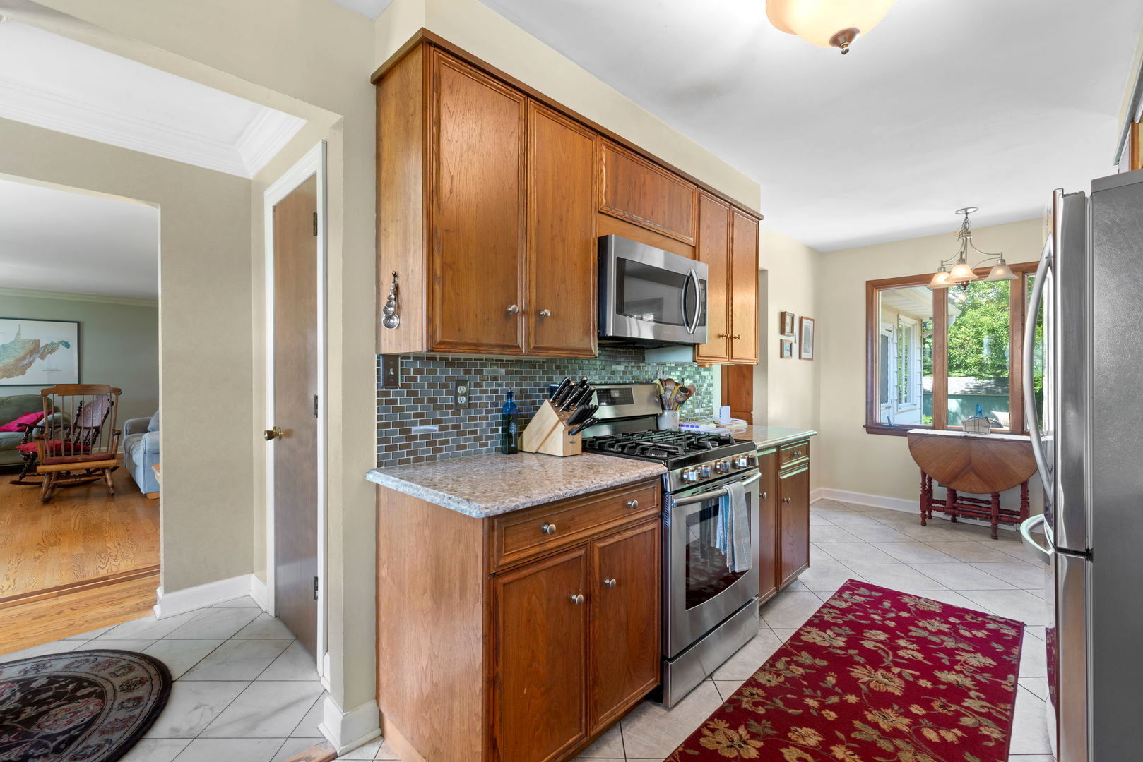 43W836 Hughes Road Elburn, IL 60119 - Photo 7 of 17 a kitchen with a stove a sink and a refrigerator