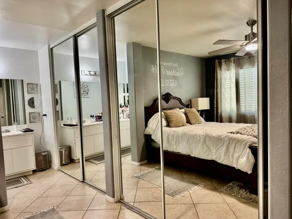 a bathroom with a sink mirror and vanity