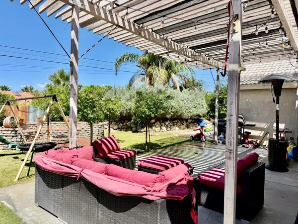 a view of an chairs and tables in the patio