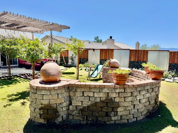 a view of a backyard with sitting area