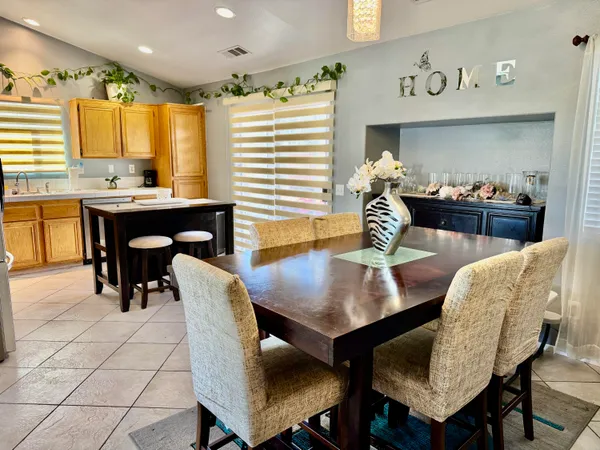 a dining room with furniture and window