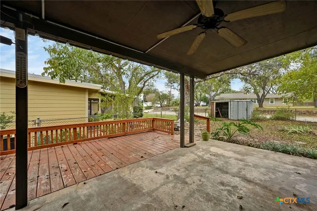 a view of a porch with wooden floor and roof