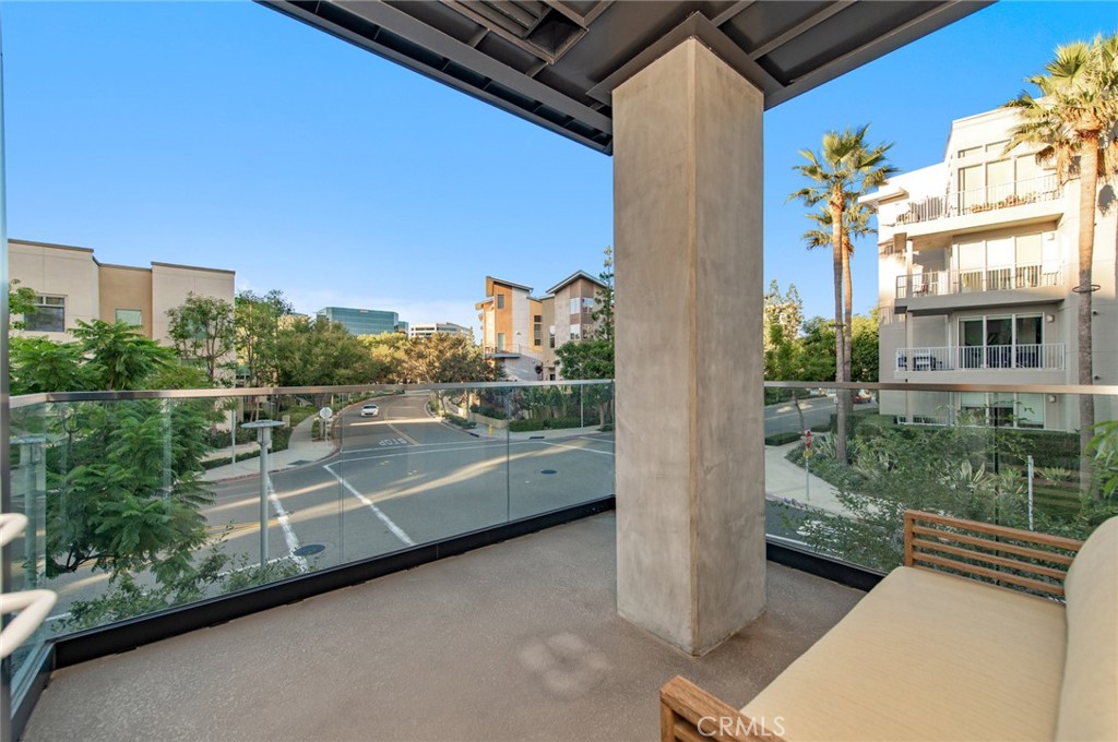 1209 Rivington Irvine, CA 92612 - Photo 20 of 38 a view of a balcony with two chairs and a table