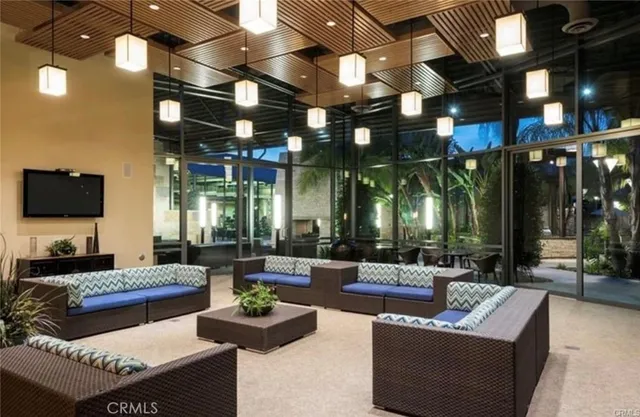 a view of patio with table and chairs a barbeque with wooden floor and fence