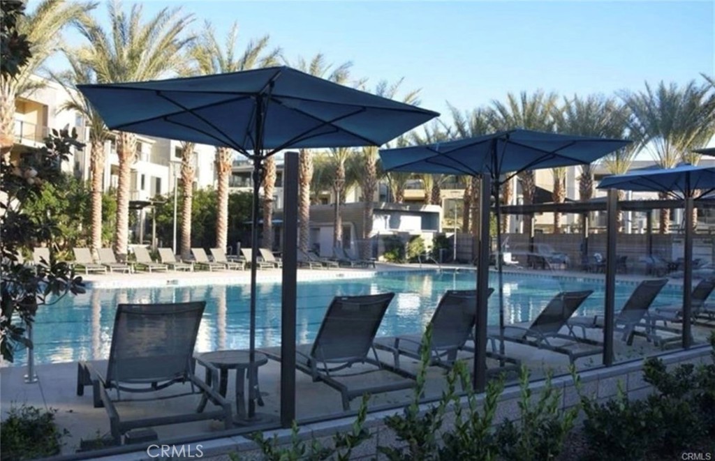 1209 Rivington Irvine, CA 92612 - Photo 35 of 38 a view of a patio with furniture and a umbrella