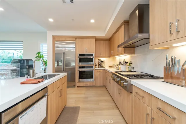a kitchen with stainless steel appliances granite countertop a sink and cabinets