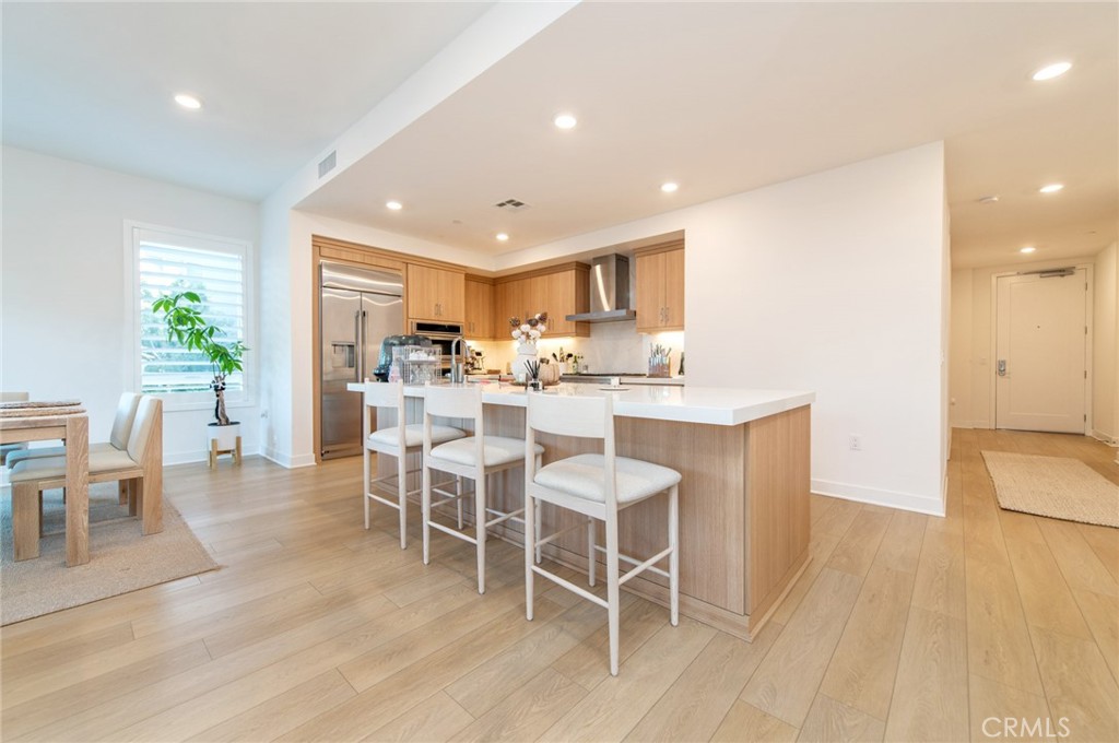 1209 Rivington Irvine, CA 92612 - Photo 9 of 38 a view of a dining room with furniture and wooden floor