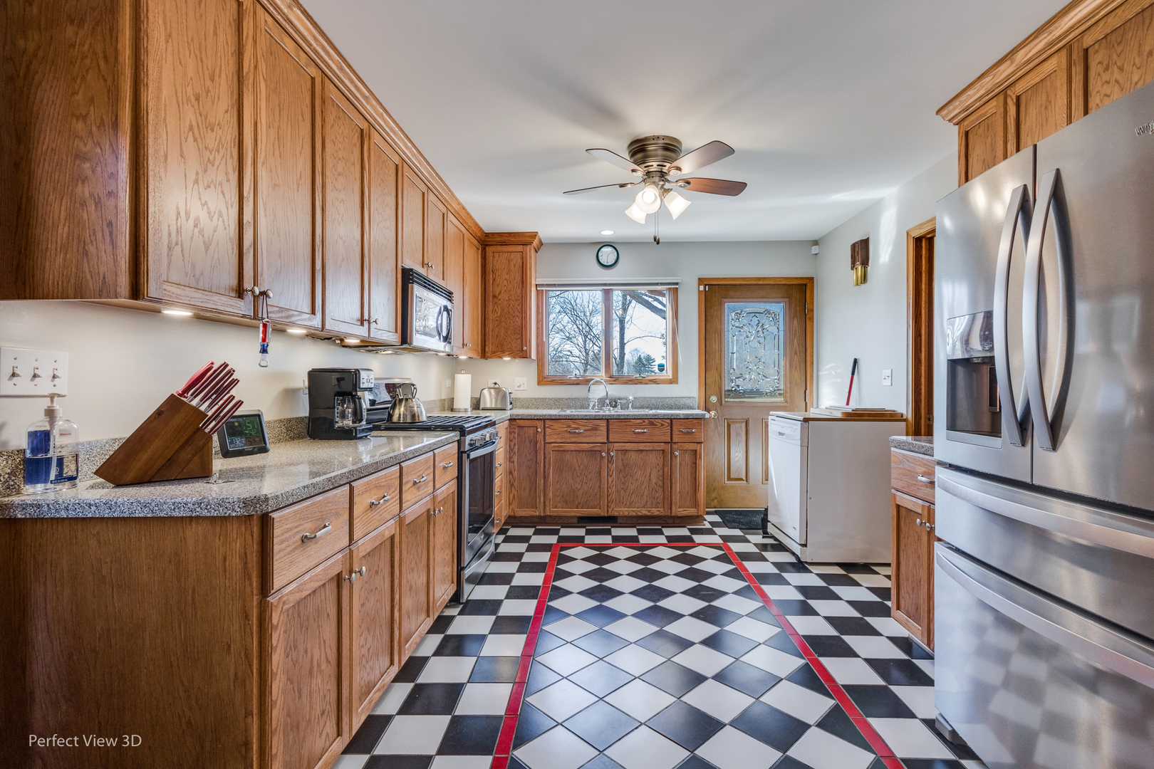 25255 South Tehle Road Elwood, IL 60421 - Photo 15 of 31 a kitchen with kitchen island granite countertop a sink appliances cabinets and a counter top space