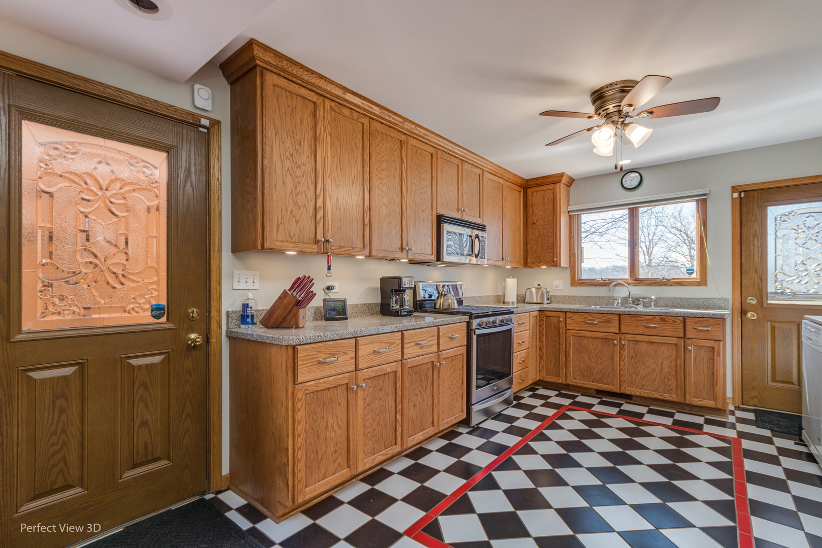 25255 South Tehle Road Elwood, IL 60421 - Photo 16 of 31 a kitchen with a stove a sink and wooden cabinets